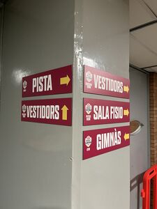 Signs on the ground floor corridor (for players and staff) Uni Girona practising at Pavelló Girona-Fontajau